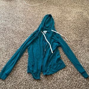 A blue zip up jacket.